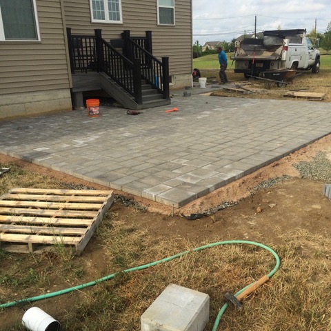 Paver patio with fire pit (during)